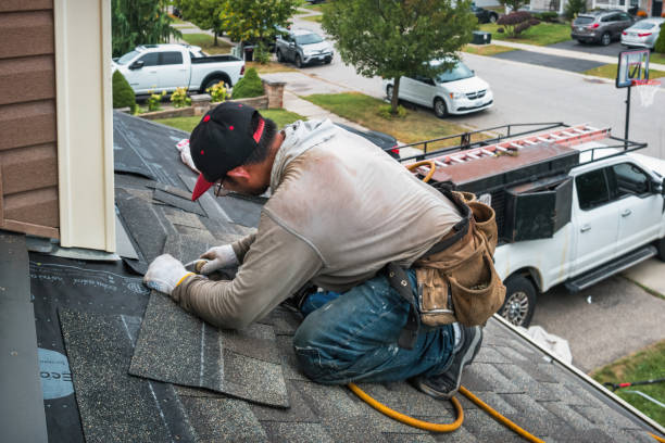 Professional Roofing technician working in Riley, OR